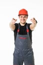 Portrait of a worker pointing his finger to a blank board isolated on white background Royalty Free Stock Photo