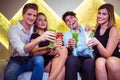 Portrait of friends enjoying cocktail in nightclub Royalty Free Stock Photo