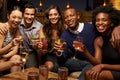 Portrait Of Friends Enjoying Night Out At Rooftop Bar Royalty Free Stock Photo