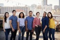 Portrait Of Friends Gathered On Rooftop Terrace For Party With City Skyline In Background Royalty Free Stock Photo