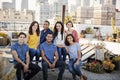 Portrait Of Friends Gathered On Rooftop Terrace For Party With City Skyline In Background Royalty Free Stock Photo