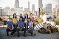 Portrait Of Friends Gathered On Rooftop Terrace For Party With City Skyline In Background Royalty Free Stock Photo