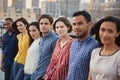 Portrait Of Friends Gathered On Rooftop Terrace For Party With City Skyline In Background Royalty Free Stock Photo