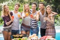 Portrait of friends having juice at outdoors barbecue party Royalty Free Stock Photo