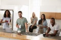 Portrait Of Friends Meeting For Coffee In Modern Kitchen