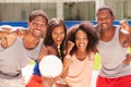 Portrait Of Friends Playing Volleyball Match