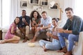 Portrait Of Friends Relaxing At Home And Drinking Wine Together Royalty Free Stock Photo