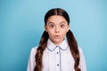 Portrait of frightened child stare stupor wear white blouse isolated over blue background