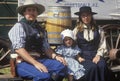 Portrait of frontier family during cowboy reenactment, CA