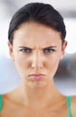 Portrait, frown and angry with woman, mad and emotions with expression and stress with pout lips. Face, person and girl Royalty Free Stock Photo