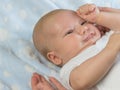 Portrait of frowning newborn boy