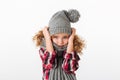 Portrait of a frozen little girl dressed in winter hat Royalty Free Stock Photo