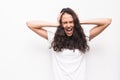 Portrait of a frustrated angry woman screaming out loud and pulling her hair out isolated on the white background Royalty Free Stock Photo