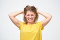 Portrait of a frustrated angry woman screaming out loud and pulling her hair out Royalty Free Stock Photo