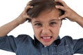 Frustrated boy standing against white background Royalty Free Stock Photo