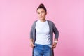 Portrait of frustrated brunette teenage girl showing empty pockets inside out. on pink background