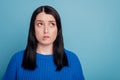 Portrait of frustrated fear girl look copyspace bite lips teeth wear stylish trendy sweater isolated over violet color