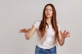 Woman walking with closed eyes, stretching hands to search way in darkness, vision problems.