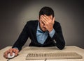 Portrait frustrated young man covering face with hands while