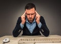 Portrait frustrated young man, hands touch the head