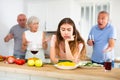 Portrait of a frustrated young woman who had a conflict with family in the kitchen