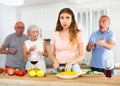 Portrait of a frustrated young woman who had a conflict with family in the kitchen