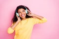 Portrait of funky cheerful african mulatto hipster youth girl have headset listen music song feel fun on break pause Royalty Free Stock Photo