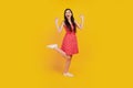 Portrait of funky excited astonished lady scream rejoice wear dotted red mini dress sneakers on yellow background Royalty Free Stock Photo