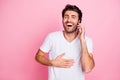 Portrait of funky positive cheerful middle eastern man indian guy hold phone calling best friend have conversation laugh Royalty Free Stock Photo