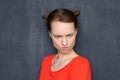 Portrait of funny angry woman looking with rebuke at camera