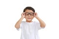 Portrait of funny asian little boy child wearing glasses isolated on white background Royalty Free Stock Photo