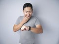 Young Man Shocked to See Wrist Watch, Late Concept Royalty Free Stock Photo