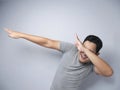 Funny Asian Man Smiling and Making Dab Movement Royalty Free Stock Photo