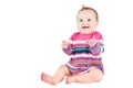 Portrait of a funny baby girl in a pink striped dress Royalty Free Stock Photo