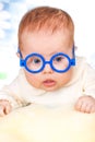 Portrait of funny baby with glasses