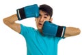 Portrait of funny brunette sports man practicing box in blue gloves isolated on white background Royalty Free Stock Photo