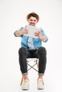 Portrait of a funny casual man playing using tablet computer Royalty Free Stock Photo