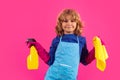 Portrait of funny child cleaning. Housekeeping and home cleaning concept. Child use duster and gloves for cleaning