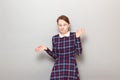 Portrait of funny confused young woman making silly goofy face Royalty Free Stock Photo