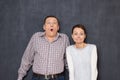 Portrait of funny couple making foolish surprised faces Royalty Free Stock Photo