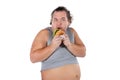 Portrait of funny fat man eating fast food burger isolated on white background