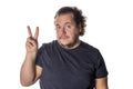 Portrait of funny fat man showing peace v-sign or victory gesture Royalty Free Stock Photo