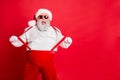 Portrait of funny fat overweight santa claus with big belly abdomen forever young touch his suspenders scream fool Royalty Free Stock Photo