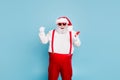 Portrait of funny funky crazy christmas father with big belly use mobile phone raise fists scream yes win in x-mas
