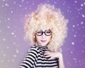 Portrait of funny girl in blonde wig. Royalty Free Stock Photo