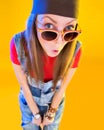 Portrait of funny girl in glasses and a brown hat Royalty Free Stock Photo