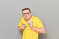 Portrait of funny greedy man holding money in hands and counting cash Royalty Free Stock Photo