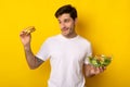 Portrait of Funny Guy Holding Burger And Salad Royalty Free Stock Photo