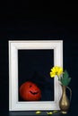 Funny Halloween. Pumpkin female in black hat with veil in retro style on white frame and vase flower on black background. Pumpkin