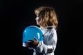 Portrait of funny kid with astronaut helmet. Child boy playing astronaut, spaceman.